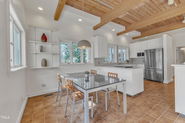 206 Spring Ln, Chapel Hill, NC 27514 - dining room with a wood ceiling with exposed beams, light tile patterned floors, and recessed lighting
