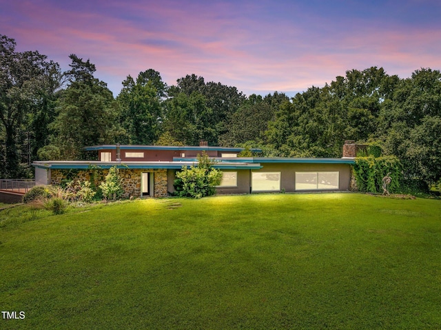115 Ashworth Dr, Durham, NC 27707 - view of front of house featuring a lawn, stucco siding, and stone siding