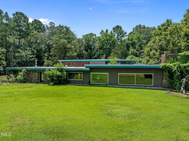 115 Ashworth Dr, Durham, NC 27707 - view of front facade featuring stucco siding and a front yard