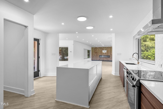 115 Ashworth Dr, Durham, NC 27707 - kitchen with stainless steel electric range, modern cabinets, wall chimney exhaust hood, recessed lighting, and light wood-style flooring