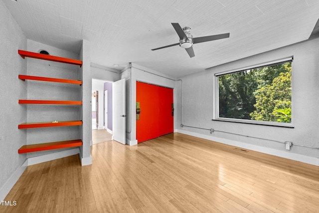 115 Ashworth Dr, Durham, NC 27707 - empty room with wood finished floors and a ceiling fan