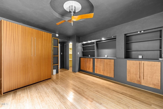 115 Ashworth Dr, Durham, NC 27707 - unfurnished living room featuring wood finished floors, ceiling fan, and built in shelves