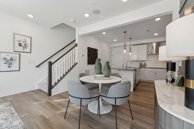 1236 S Person St Unit 101, Raleigh, NC 27601 - dining room featuring wood finished floors, stairs, and recessed lighting
