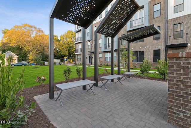 1236 S Person St Unit 101, Raleigh, NC 27601 - surrounding community featuring a playground, a lawn, and a patio area