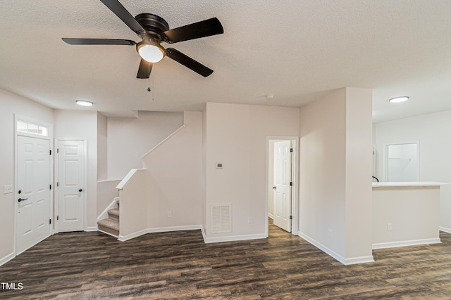 2738 Garden Knoll Ln, Raleigh, NC 27614 - spare room with wood finished floors, a textured ceiling, ceiling fan, and stairway