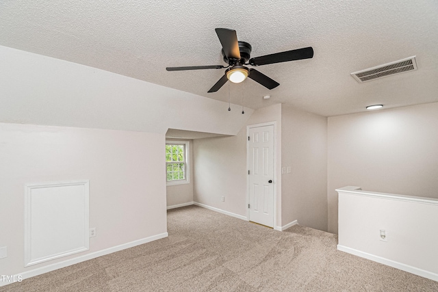 2738 Garden Knoll Ln, Raleigh, NC 27614 - unfurnished room featuring a ceiling fan, a textured ceiling, vaulted ceiling, and carpet flooring