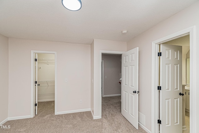 2738 Garden Knoll Ln, Raleigh, NC 27614 - unfurnished bedroom with a spacious closet and light carpet