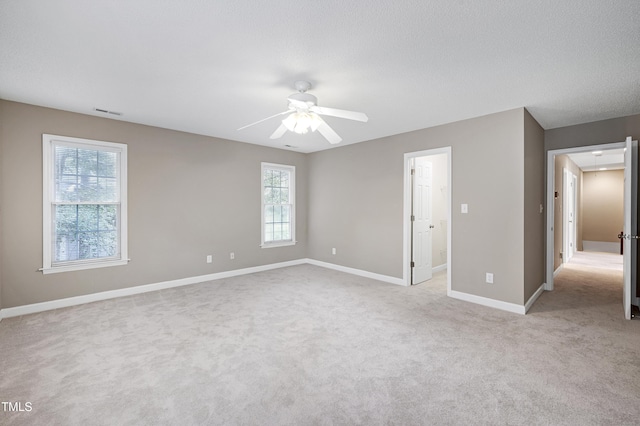 102 Whitlock Ln, Cary, NC 27513 - unfurnished bedroom with light colored carpet, multiple windows, and ceiling fan