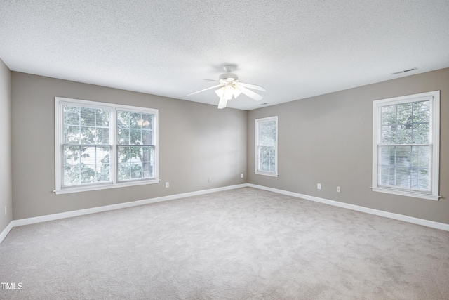 102 Whitlock Ln, Cary, NC 27513 - carpeted empty room featuring healthy amount of natural light, ceiling fan, and a textured ceiling