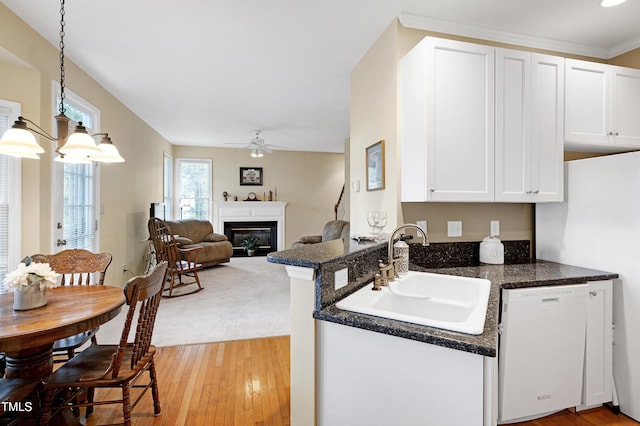 102 Whitlock Ln, Cary, NC 27513 - kitchen featuring white appliances, light wood-style floors, a ceiling fan, and white cabinets