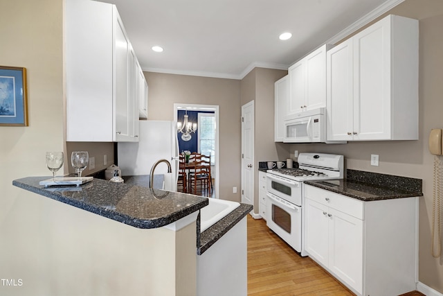 102 Whitlock Ln, Cary, NC 27513 - kitchen with white appliances, light wood-type flooring, white cabinetry, a peninsula, and recessed lighting