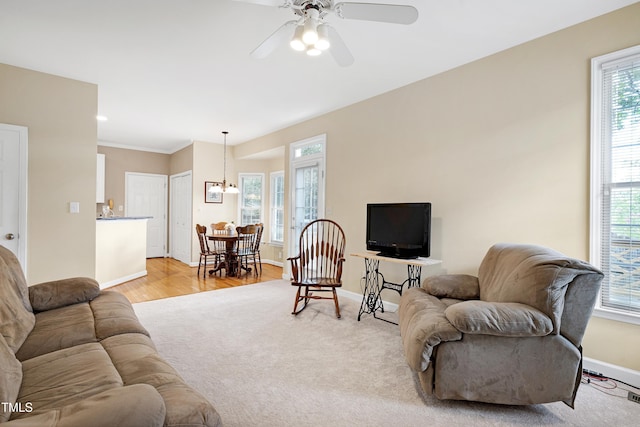 102 Whitlock Ln, Cary, NC 27513 - living area featuring a ceiling fan, light wood-type flooring, and a chandelier