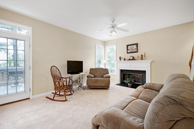 102 Whitlock Ln, Cary, NC 27513 - living area with carpet, plenty of natural light, a ceiling fan, and a fireplace with flush hearth