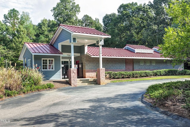 102 Whitlock Ln, Cary, NC 27513 - view of front of property featuring a standing seam roof, a metal roof, and covered porch