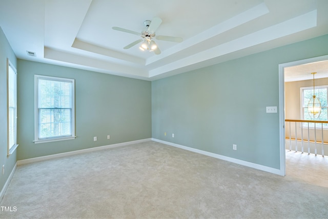 102 Whitlock Ln, Cary, NC 27513 - carpeted spare room with a tray ceiling and ceiling fan