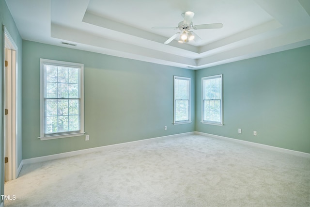 102 Whitlock Ln, Cary, NC 27513 - unfurnished room with a raised ceiling, carpet, and ceiling fan