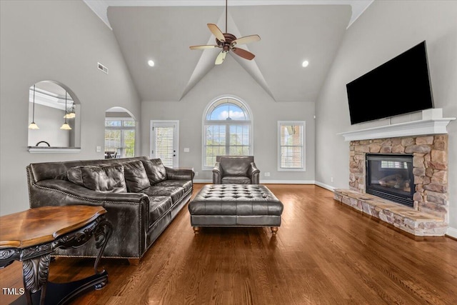 2011 Gibsonville Ossipee Rd, Elon, NC 27244 - living room with wood finished floors, ceiling fan, a fireplace, high vaulted ceiling, and recessed lighting