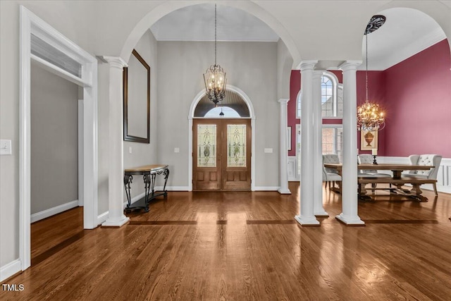 2011 Gibsonville Ossipee Rd, Elon, NC 27244 - entrance foyer featuring a chandelier, wood finished floors, a high ceiling, and ornate columns