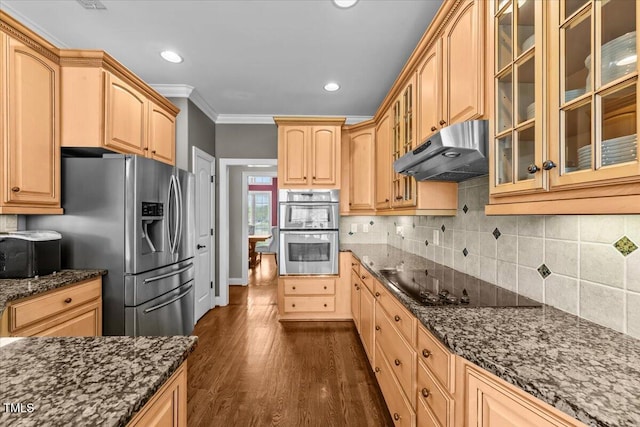 2011 Gibsonville Ossipee Rd, Elon, NC 27244 - kitchen with appliances with stainless steel finishes, under cabinet range hood, crown molding, dark stone counters, and dark wood finished floors