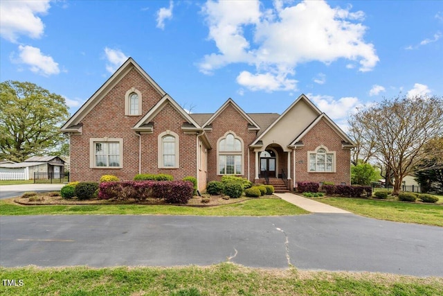 2011 Gibsonville Ossipee Rd, Elon, NC 27244 - single story home with brick siding