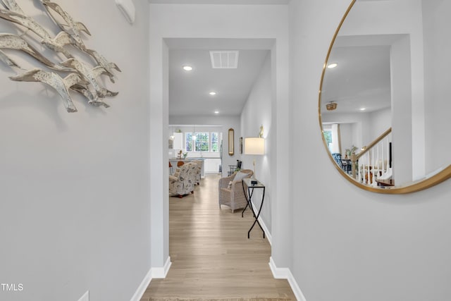 110 Gilder Woods Dr, Garner, NC 27529 - corridor with light wood finished floors and recessed lighting