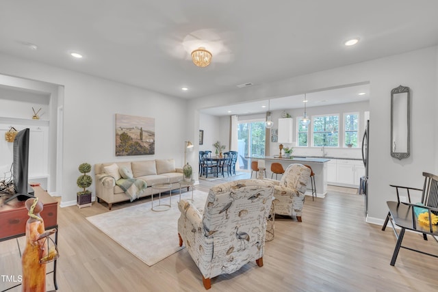 110 Gilder Woods Dr, Garner, NC 27529 - living area with light wood-style flooring and recessed lighting