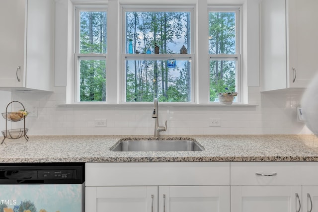 110 Gilder Woods Dr, Garner, NC 27529 - kitchen featuring dishwasher, white cabinetry, and plenty of natural light