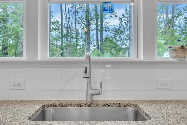 110 Gilder Woods Dr, Garner, NC 27529 - kitchen view of decorative backsplash and light stone countertops