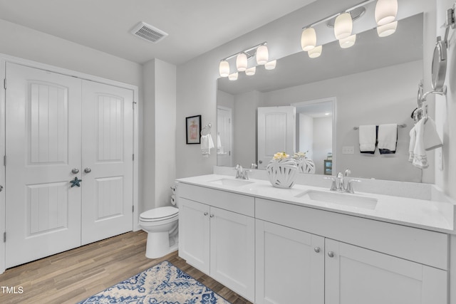 110 Gilder Woods Dr, Garner, NC 27529 - bathroom featuring double vanity and wood finished floors