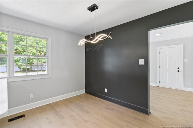 6123 Malvern Cir, Fayetteville, NC 28314 - spare room with light wood-type flooring and a chandelier