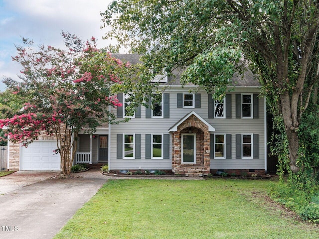 3525 Lytham Pl, Raleigh, NC 27604 - colonial home featuring driveway, a front lawn, a garage, and roof with shingles