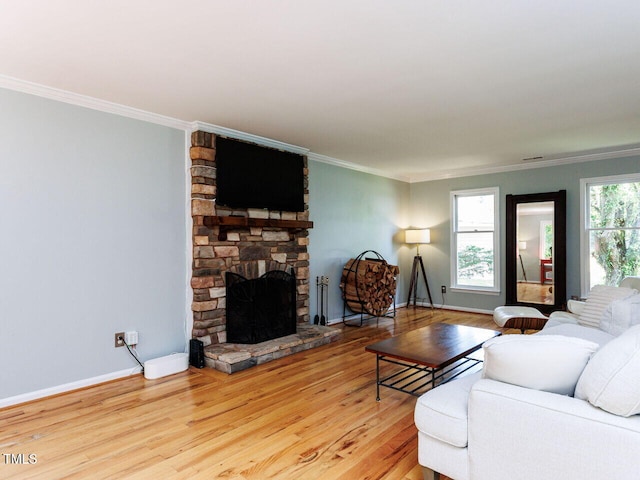 3525 Lytham Pl, Raleigh, NC 27604 - living room with wood finished floors, ornamental molding, and a stone fireplace