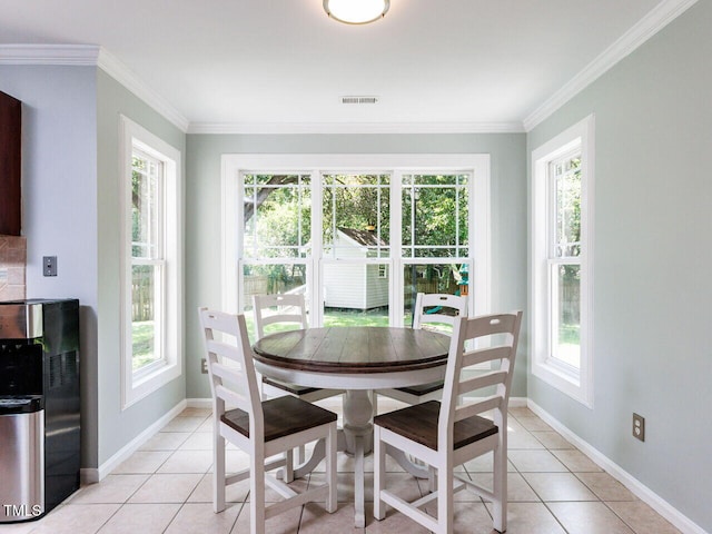 3525 Lytham Pl, Raleigh, NC 27604 - dining space featuring healthy amount of natural light, light tile patterned floors, and crown molding