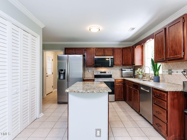 3525 Lytham Pl, Raleigh, NC 27604 - kitchen featuring stainless steel appliances, a center island, light tile patterned flooring, ornamental molding, and decorative backsplash