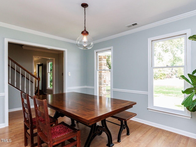 3525 Lytham Pl, Raleigh, NC 27604 - dining space with healthy amount of natural light, light wood-type flooring, and crown molding