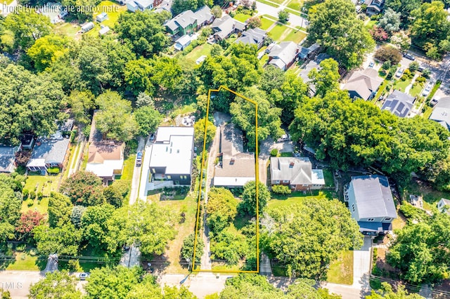 1228 Marshall St, Raleigh, NC 27604 - aerial perspective of suburban area featuring property parcel outlined and a tree filled landscape