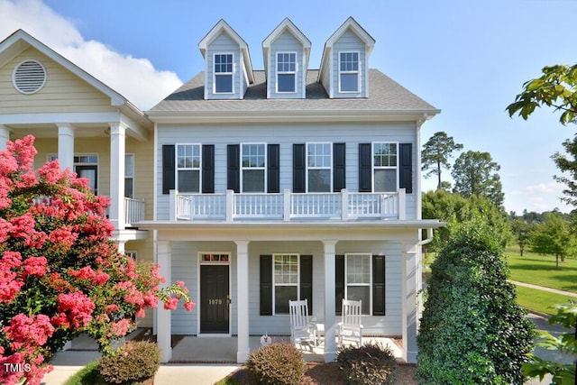 1079 Perdue Dr, Chapel Hill, NC 27517 - view of front of house featuring covered porch, a balcony, and roof with shingles