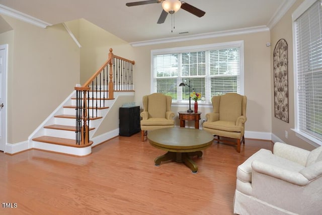 1079 Perdue Dr, Chapel Hill, NC 27517 - sitting room featuring wood finished floors, stairs, a ceiling fan, and ornamental molding