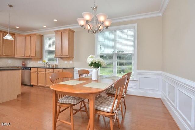1079 Perdue Dr, Chapel Hill, NC 27517 - dining area featuring a chandelier, ornamental molding, light wood-style floors, a wainscoted wall, and recessed lighting