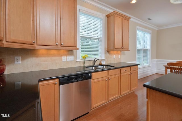 1079 Perdue Dr, Chapel Hill, NC 27517 - kitchen with dark countertops, dishwasher, light wood-style flooring, crown molding, and a wainscoted wall
