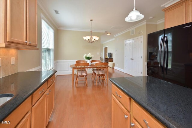 1079 Perdue Dr, Chapel Hill, NC 27517 - kitchen with crown molding, freestanding refrigerator, light wood-type flooring, decorative light fixtures, and a chandelier
