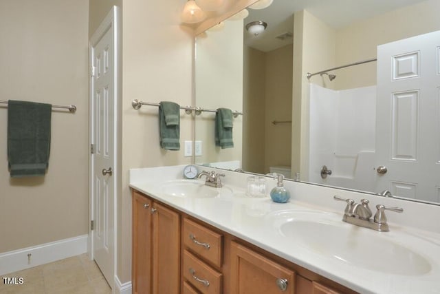 1079 Perdue Dr, Chapel Hill, NC 27517 - bathroom featuring double vanity and tile patterned floors
