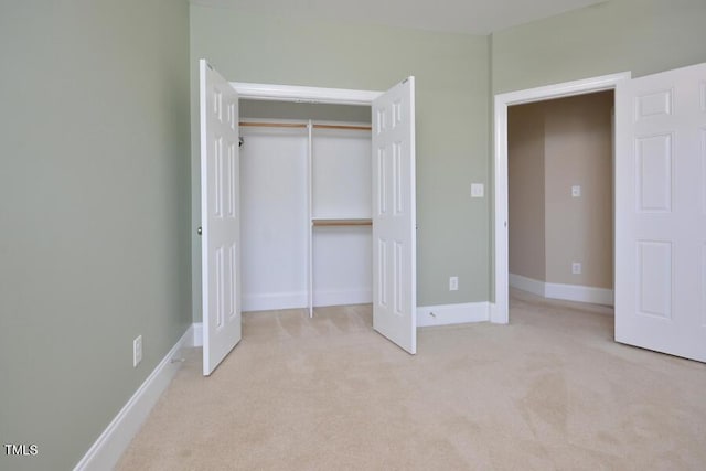 1079 Perdue Dr, Chapel Hill, NC 27517 - unfurnished bedroom featuring light colored carpet and a closet