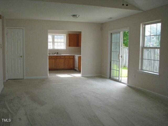 4419 Nightfall Ct, Durham, NC 27713 - unfurnished living room featuring light colored carpet and ceiling fan
