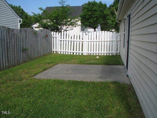 4419 Nightfall Ct, Durham, NC 27713 - fenced yard featuring a patio area