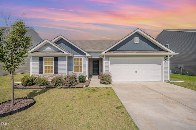 757 Frosty Way, Zebulon, NC 27597 - view of front of property featuring concrete driveway, a front yard, board and batten siding, and a garage