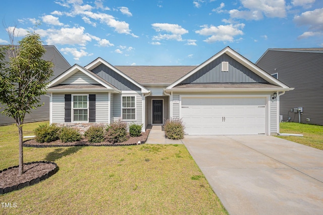 757 Frosty Way, Zebulon, NC 27597 - single story home featuring board and batten siding, concrete driveway, a garage, and a front yard