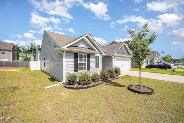 757 Frosty Way, Zebulon, NC 27597 - view of front of home featuring concrete driveway, a garage, stone siding, and a shingled roof