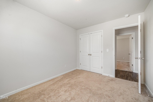 757 Frosty Way, Zebulon, NC 27597 - unfurnished bedroom featuring carpet and a closet