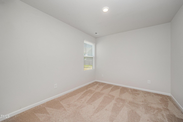757 Frosty Way, Zebulon, NC 27597 - unfurnished room featuring light colored carpet and recessed lighting
